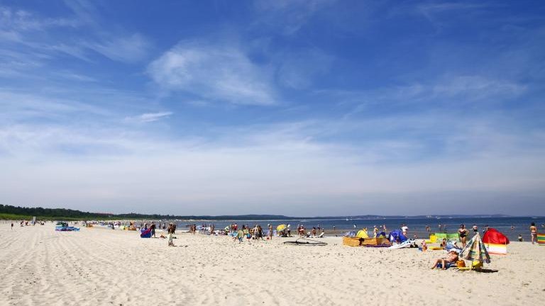 Crowded Baltic summer beach in Swinoujscie, Poland shutterstock_141272014.jpg