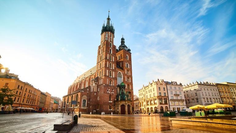 St. Mary's Basilica on the Krakow Main Square (Rynek Glowny) during the sunrise, Poland shutterstock_1668098119.jpg